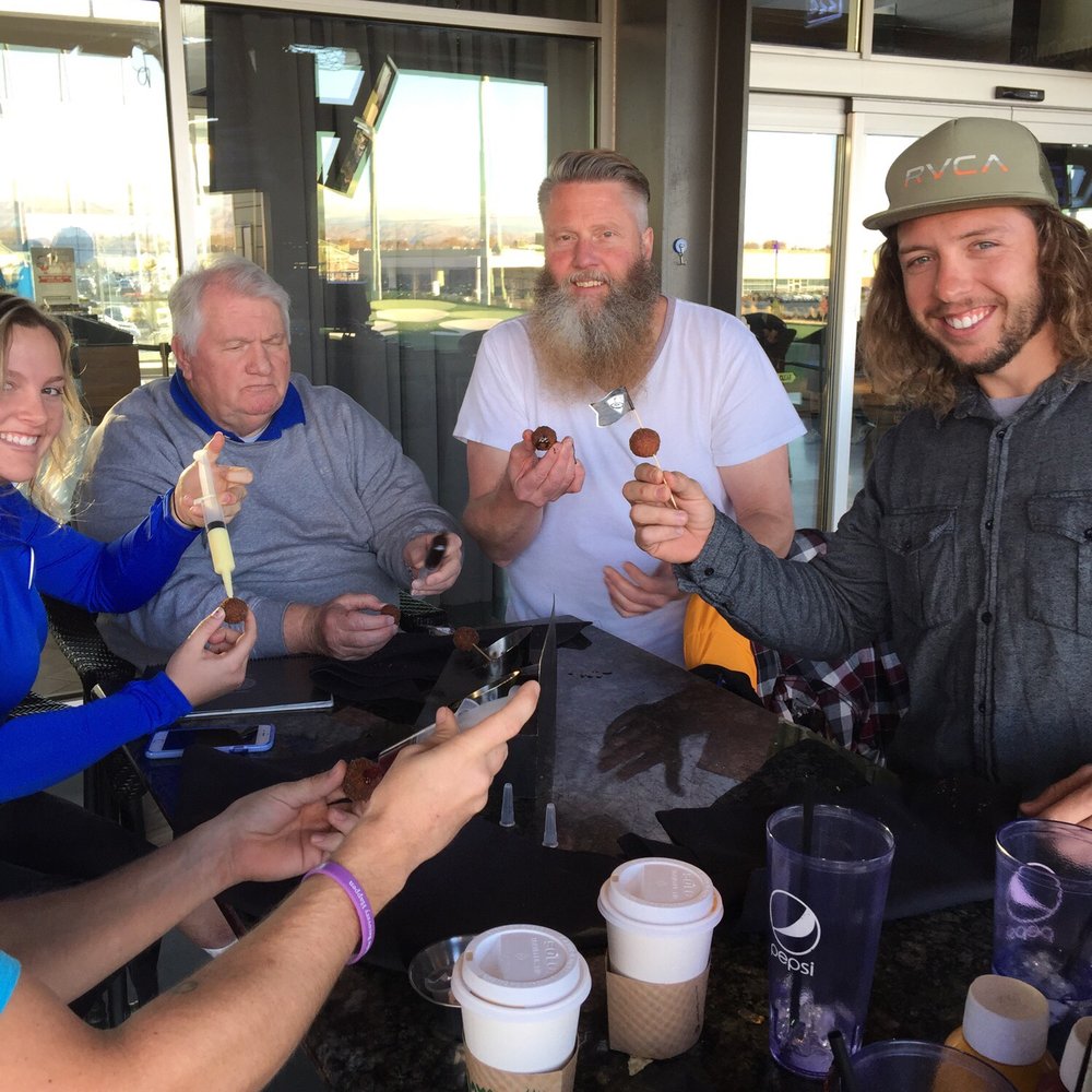 Topgolf - injecting our donut holes with bavarian cream. - Sports Bars Near Me - Midvale, Utah Topgolf - injecting our donut holes with bavarian cream. - Sports Bars Near Me - Midvale, Utah