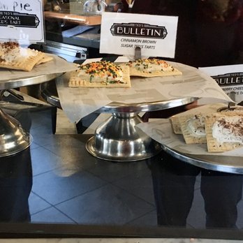 Ted's Bulletin Reston - Display of Ted's Tarts (their version of the Pop Tart) in different flavors sit enticingly on raised displays as you walk in - Breakfast & Brunch Near Me - Reston, Virginia Ted's Bulletin Reston - Display of Ted's Tarts (their version of the Pop Tart) in different flavors sit enticingly on raised displays as you walk in - Breakfast & Brunch Near Me - Reston, Virginia