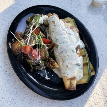 OC Fish Grill - Garlic butter Sea bass with grilled zucchini and Brussels sprouts - Seafood Near Me - Irvine, California OC Fish Grill - Garlic butter Sea bass with grilled zucchini and Brussels sprouts - Seafood Near Me - Irvine, California