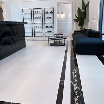 Modern Creation - a man's feet on a black and white floor - General Contractors Near Me Modern Creation - a man's feet on a black and white floor - General Contractors Near Me