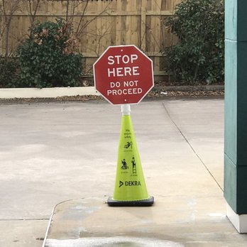 DEKRA Vehicle Inspection Station - Stop sign that says we're supposed to go around - Smog Check Stations Near Me - Plano, Texas DEKRA Vehicle Inspection Station - Stop sign that says we're supposed to go around - Smog Check Stations Near Me - Plano, Texas