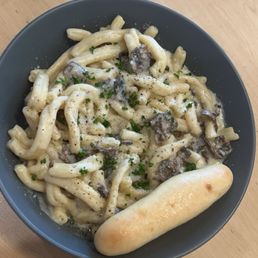 Chefs pasta with Alfredo sauce, cremini mushrooms, and truffle oil Chefs pasta with Alfredo sauce, cremini mushrooms, and truffle oil
