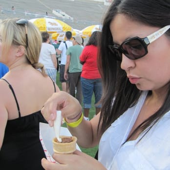 La Street Food Fest - The wife applies frosting to the brownie cone. - Festivals Near Me - Arcadia, California La Street Food Fest - The wife applies frosting to the brownie cone. - Festivals Near Me - Arcadia, California