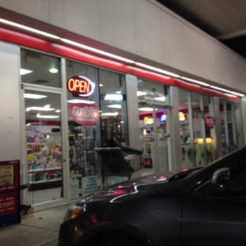 Exxon - a car parked in front of a convenience store - Gas Stations Near Me - Bastrop, Texas