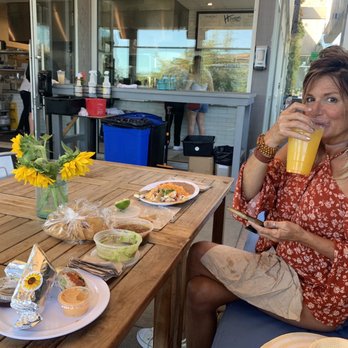 Howdy's Sonrisa Cafe - Christine sipping on the orange, turmeric glow agua fresca! - Cafes Near Me - Malibu, California Howdy's Sonrisa Cafe - Christine sipping on the orange, turmeric glow agua fresca! - Cafes Near Me - Malibu, California