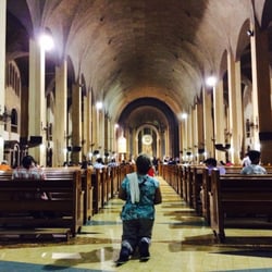 Baclaran Church - Devotees walk on their knees towards the altar while praying the novena or the rosary.