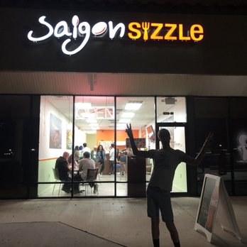 Saigon Sizzle - Silhouette of my husband in front of the shop - Vietnamese Near Me - Orange City, Florida Saigon Sizzle - Silhouette of my husband in front of the shop - Vietnamese Near Me - Orange City, Florida