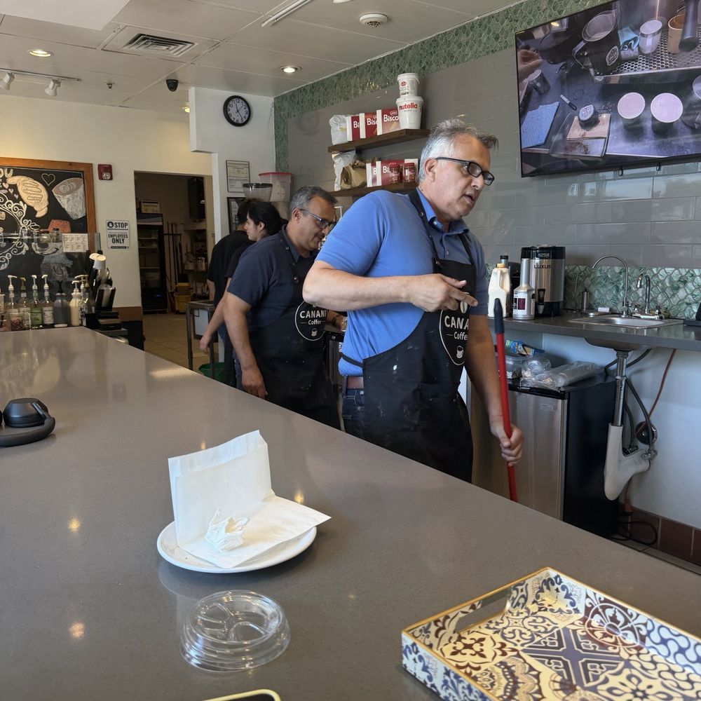 The family that owns the coffee shop just doing their thing..