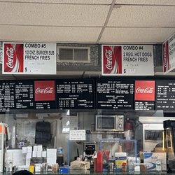 J J Grocery & Deli - Counter with menu prices