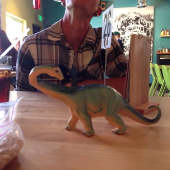 Laughing Planet - Dinosaurs on the tables about to eat my husband! Ahhh - Vegetarian Near Me - Reno, Nevada Laughing Planet - Dinosaurs on the tables about to eat my husband! Ahhh - Vegetarian Near Me - Reno, Nevada