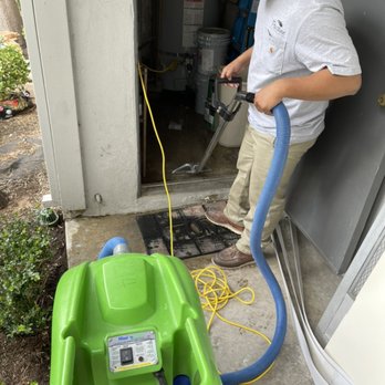 Pristine Restoration - Water extraction of water heater room. Our technician Daniel hard at work! - Damage Restoration Near Me Pristine Restoration - Water extraction of water heater room. Our technician Daniel hard at work! - Damage Restoration Near Me