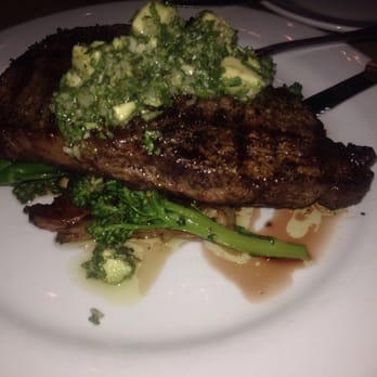 Ember - Delicious Ribeye with an avocado chimmichuri, garlic confit and roasted potatoes - New American Near Me - Arroyo Grande, California Ember - Delicious Ribeye with an avocado chimmichuri, garlic confit and roasted potatoes - New American Near Me - Arroyo Grande, California