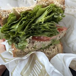 Tuna sandwich with extra lettuce and tomatoes. Tuna sandwich with extra lettuce and tomatoes.