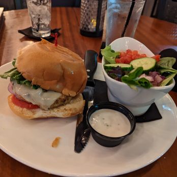 The Hangry Bison - Salmon burger with salad - New American Near Me - Winter Park, Florida