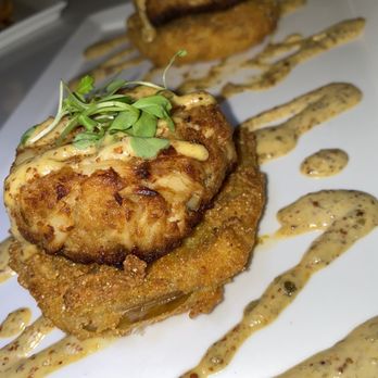 The Tilted Row - Crab cakes over fried green tomatoes - Cocktail Bars Near Me - Baltimore, Maryland The Tilted Row - Crab cakes over fried green tomatoes - Cocktail Bars Near Me - Baltimore, Maryland