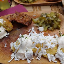 Restauration Roumaine - Sarmale with polenta (boiled cornmeal), cheese, pickles and sausage.