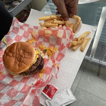 Johnny's Big Burger - Double cheeseburger w/ fries plus my husband's hand - Burgers Near Me - Clarksville, Tennessee