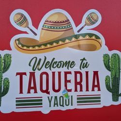 Taqueria Yaqui - The back side of the food truck/trailer with the large logo.