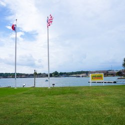 Lockaway Storage - View of Lake with Lockaway Storage Sign, Texas Flag and American Flag