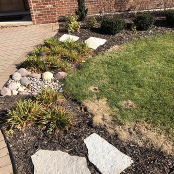 K & R Landscaping - a front yard with stepping stones - Landscaping Near Me - Plainfield, Illinois