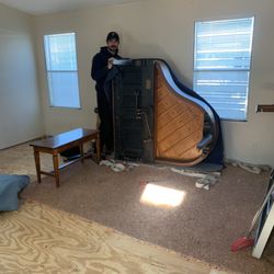 Howes Piano Services - Moving baby grand piano.