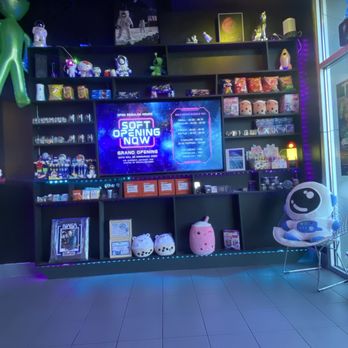 Rocketbelly - Wall full of merchandise, memorabilia, and snacks - Desserts Near Me - Arlington, Texas