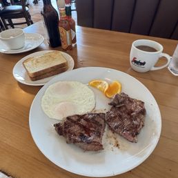 Steak and eggs over medium served with sourdough toast and fruit (not pictured) Steak and eggs over medium served with sourdough toast and fruit (not pictured)
