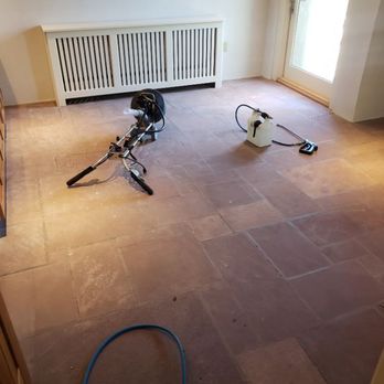 EK Does it All - Setting up equipment to clean a stone tile floor. - Office Cleaning Near Me