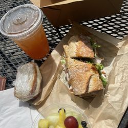 Farm Basket - Lunch Box: Smoked Turkey And Brie sandwich with a side of fruit, the Lemon Nut Bread Cream Cheese Filling, and an Arnold Palmer.