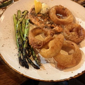 The Bear Paw Bar & Grill - Alaskan Salmon with onion rings and asparagus - American Near Me - Anchorage, Alaska