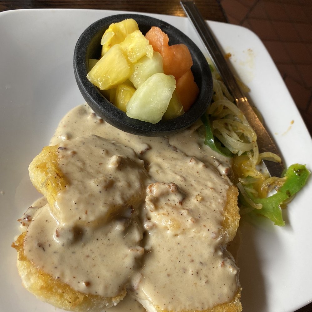 Tortuga Jack's - Biscuits and gravy with sausage and side of fruit. - Mexican Near Me - Jekyll Island, Georgia Tortuga Jack's - Biscuits and gravy with sausage and side of fruit. - Mexican Near Me - Jekyll Island, Georgia
