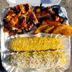 Jerk Zone Jamaican Food Kiosk - Zone Combo: 1/4 lb Jerk Chicken, 1/4 lb. Jerk Pork, Elotes/Grilled Corn w. Butter, Fried plantains & pikliz, 1 free can Soda