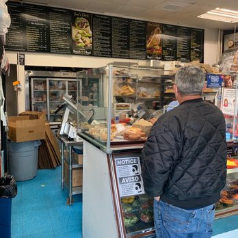 Joe's Deli - a man standing in front of a deli counter - Delis Near Me - New Rochelle, New York