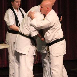 603 Karate - Receiving a promotion at a black belt ceremony