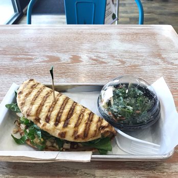 Tropical Smoothie Cafe - Chipotle chicken flatbread with a side of Kale apple slaw - Juice Bars & Smoothies Near Me - Victoria, Texas Tropical Smoothie Cafe - Chipotle chicken flatbread with a side of Kale apple slaw - Juice Bars & Smoothies Near Me - Victoria, Texas