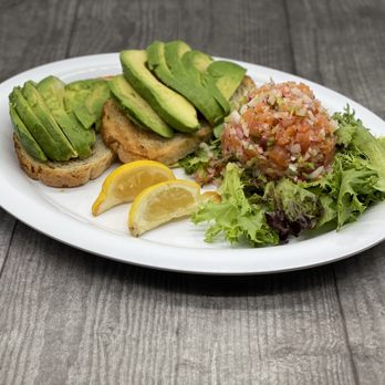 Roasters 'N Toasters - Smoked salmon, red onion, dill, and extra virgin olive oil minced into a tartare. Served with avocado on rye toast. - Delis Near Me - North Miami Beach, Florida Roasters 'N Toasters - Smoked salmon, red onion, dill, and extra virgin olive oil minced into a tartare. Served with avocado on rye toast. - Delis Near Me - North Miami Beach, Florida