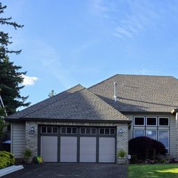 Before new trim, garage door and paint