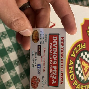 Divino's Pizzeria - a hand holding a pizza box - Pizza Near Me - Dallas, Texas