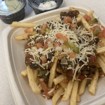 ChagaRoot - Chili cheese fries with sour cream and avocado lime sauce on the side. - Burgers Near Me - Las Vegas, Nevada