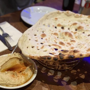 Iran Restaurant - Bread with holes and exotic sauce that i am not sure whats the ingredients - Persian/Iranian Near Me - London, XGL