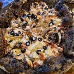 MEM Al Mare - Charcoal pizza with artichoke, olives, mushrooms and cheese.