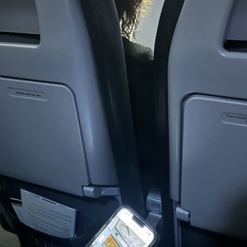 Frontier Airlines - This is me sitting in an uncomfortable seat, so that the flight attendant sit in my paid for seat - Airlines Near Me - Santa Ana, California Frontier Airlines - This is me sitting in an uncomfortable seat, so that the flight attendant sit in my paid for seat - Airlines Near Me - Santa Ana, California