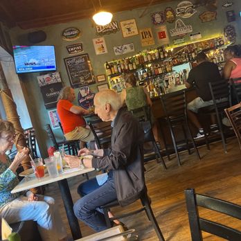 Toast - people sitting at tables in a restaurant - New American Near Me - New York, New York Toast - people sitting at tables in a restaurant - New American Near Me - New York, New York