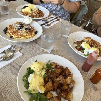 Shorehouse Kitchen - Eggs Benedict and Cornmeal Pancakes with Lemon & Blueberries - Coffee & Tea Near Me - La Jolla, California Shorehouse Kitchen - Eggs Benedict and Cornmeal Pancakes with Lemon & Blueberries - Coffee & Tea Near Me - La Jolla, California
