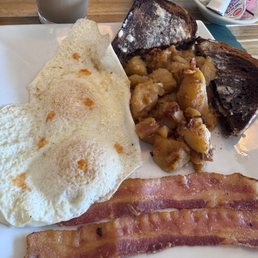 Eggs home fries rye toast and bacon Eggs home fries rye toast and bacon