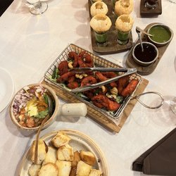 (from top to bottom) Gol Gappe Shots, Chicken 65, Pav Bhaji Fondue