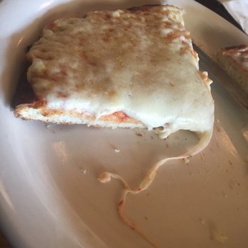Che Tito's - Crispy pizza with mounds of cheese and light on the sauce - Pizza Near Me - Miami, Florida