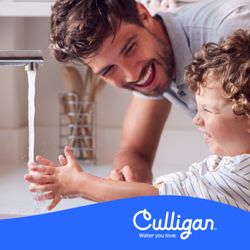Father and son at sink using Culligan soft water