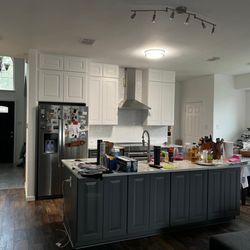 Decohub Home Store - We remodeled our customer's kitchen using stylish white and gray shaker cabinets. The updated design brings a fresh, modern look to the spac