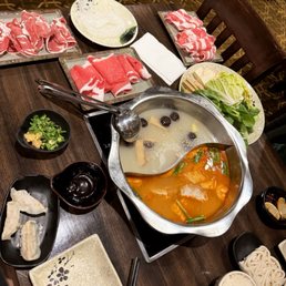 a hot pot of soup on a table